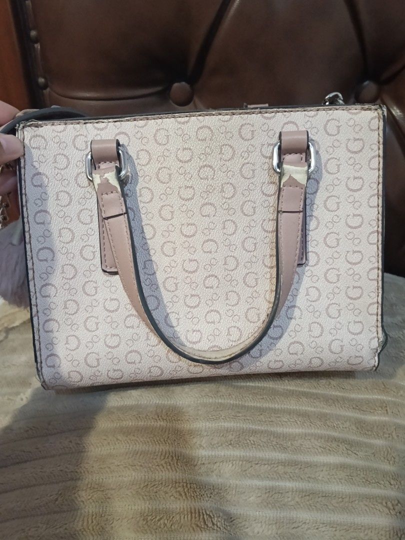 Guess Monogram Mini Handbag Shoulder Bag (Category: Luxury Bags & Wallets) located in Quezon City. Submitted by keycee_20 (Listing ID 1459623805, Image 3). Description: - Cute Guess mini handbag - Pink and beige monogram pattern - Top handles and long adjustable strap - Versatile wear: shoulder bag or crossbody - Multiple interior compartments for organization - Minor wear on handle attachments (please check photos for details).