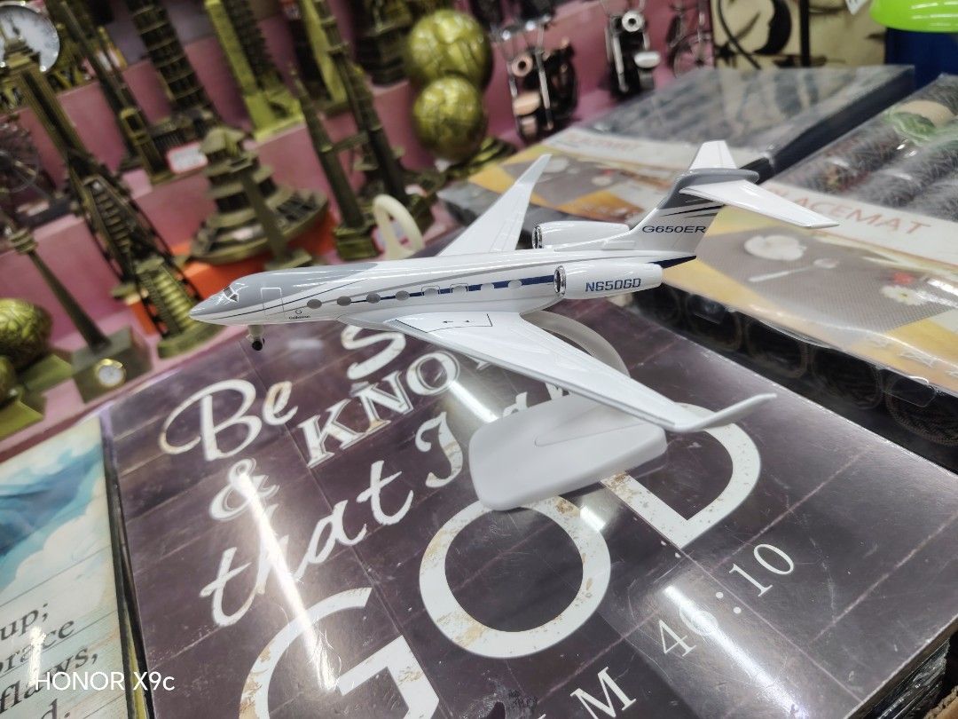 Gulfstream G650ER Airplane Model N650GD (Category: Vehicle & Diecast Models) located in Manila. Submitted by marvieobordo (Listing ID 1459540088, Image 2). Description: - Model Airplane: Gulfstream G650ER - Registration: N650GD - Color: White with grey accents - Includes: Display stand - Size: Approximately 10 inches in length - Ideal for: Collectors and aviation enthusiasts.