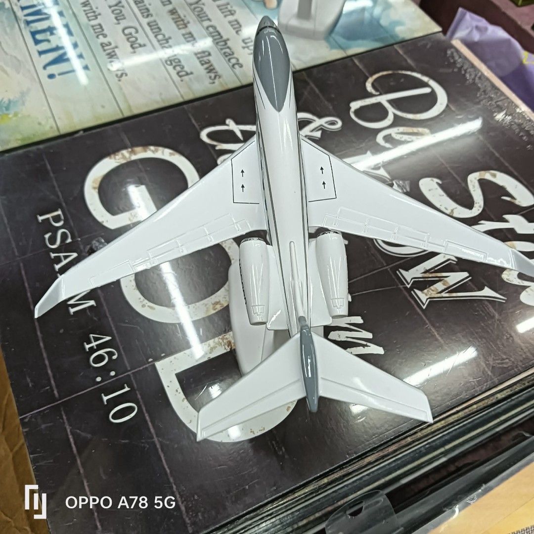 Gulfstream G650ER Model Airplane N650GD (Category: Vehicle & Diecast Models) located in Manila. Submitted by iliasjen3082126 (Listing ID 1459648901, Image 2). Description: Model of a Gulfstream G650ER private jet. Registration N650GD. White with grey accents and blue stripe details. Comes with a display stand. Great for collectors or aviation enthusiasts. Measures approximately [insert length if known] long. A nice piece for display..