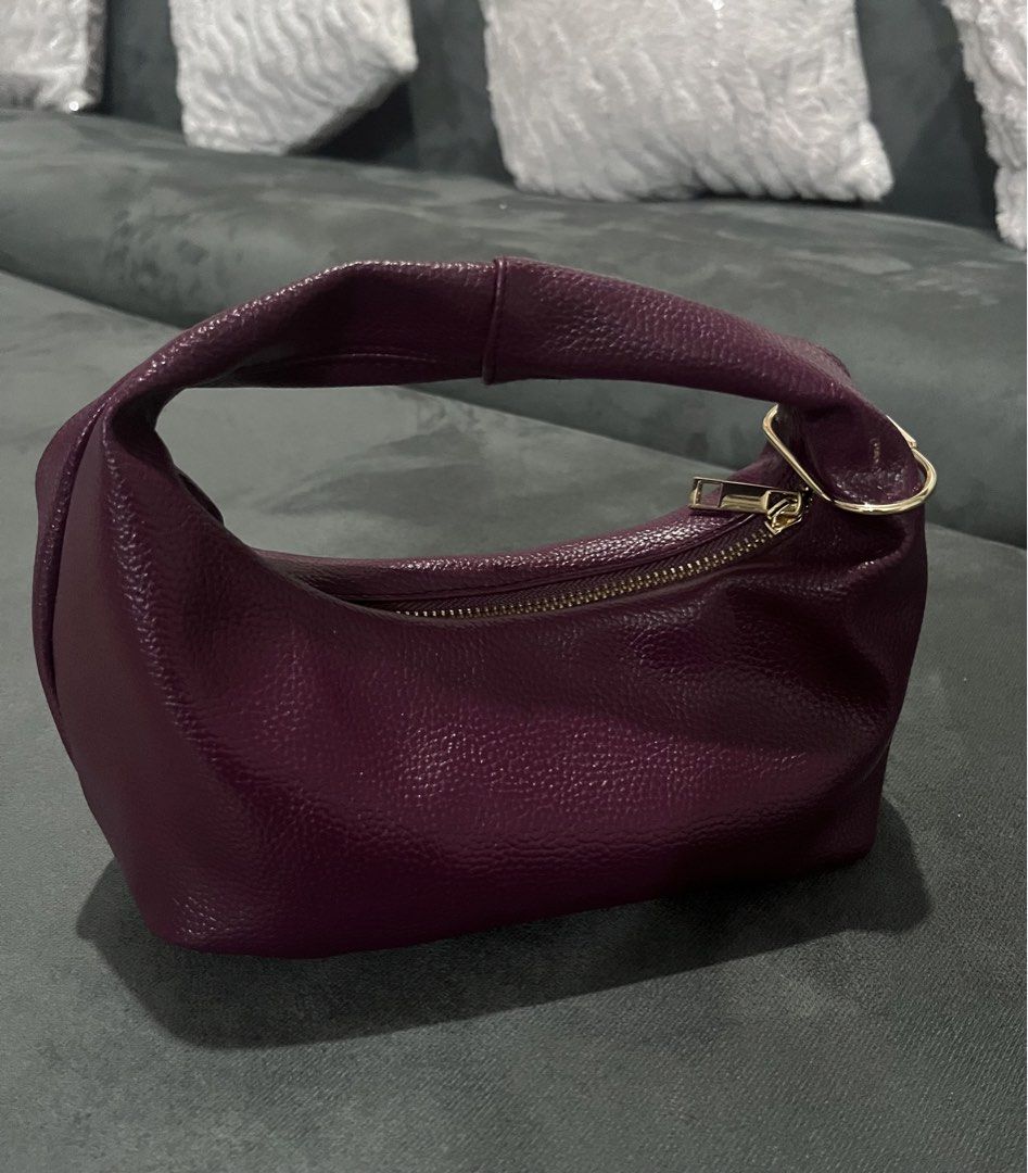 GVN mini hobo bag (Category: Luxury Bags & Wallets) located in Quezon City. Submitted by princesssparklee (Listing ID 1459596605, Image 2). Description: - Plum colored leather handbag (lightly pebbled) - Textured leather finish - Gold hardware details - Can provide more pictures upon request Width 8" Height 7" Zipper to base 3.3".