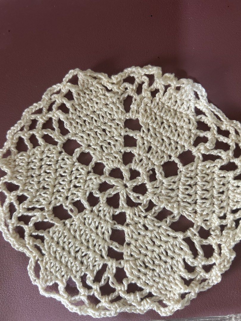 Handmade Crochet Doily (Category: Other Kitchenware & Tableware) located in Marikina City. Submitted by jennyggg25 (Listing ID 1459524316, Image 1). Description: - Cream-colored crochet doily - Intricate floral pattern in the center - Delicate scalloped edge - Approximately 8 inches in diameter - Ideal for home decor or as a craft project - Handmade with care.