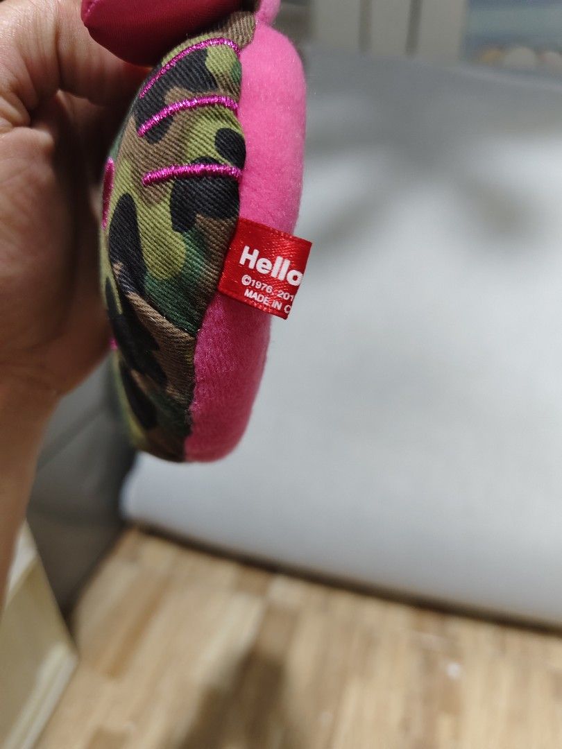 Hello Kitty Camouflage keychain with Mirror (Category: Purses & Pouches) located in Makati City. Submitted by abegailbrezuela (Listing ID 1459615895, Image 3). Description: - Features a cool camouflage print on one side - Soft pink fuzzy interior on the other side - Includes a small pink bow accent - Built-in mirror inside for quick touch-ups - Convenient keychain attachment - Ideal for storing coins, cash, or small essentials - Compact size, per