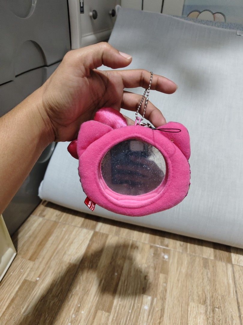 Hello Kitty Camouflage keychain with Mirror (Category: Purses & Pouches) located in Makati City. Submitted by abegailbrezuela (Listing ID 1459615895, Image 2). Description: - Features a cool camouflage print on one side - Soft pink fuzzy interior on the other side - Includes a small pink bow accent - Built-in mirror inside for quick touch-ups - Convenient keychain attachment - Ideal for storing coins, cash, or small essentials - Compact size, per