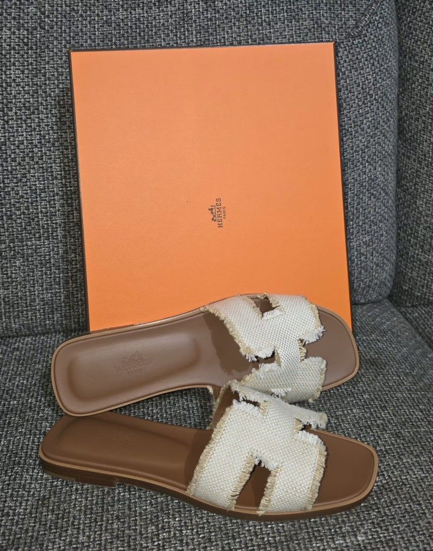 Hermes Oran Sandals (Category: Sneakers & Footwear) located in Manila. Submitted by colette_jico (Listing ID 1459604757, Image 2). Description: - Authentic Hermes Oran Sandals - Color: Natural Canvas with Brown Leather - Iconic 'H' Design - Comes with original Hermes box - Ideal for summer fashion - size 8 - never been used no more last price meet up only ayala malls feliz sm megamall.