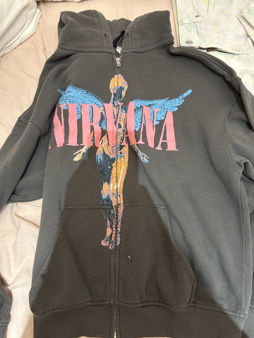 H&M Divided Nirvana Graphic Zip-Up Hoodie (Category: Coats, Jackets and Outerwear) located in Manila. Submitted by coquettecosette (Listing ID 1459555658, Image 1). Description: 🩶 H&M Divided Nirvana Zip-Up Hoodie 🎀 Cute grey zip-up hoodie featuring the iconic Nirvana smiley face graphic on the front ♡ Size XS. Perfect for casual outfits, layering, or adding a cute grunge touch to your look ✧ In good condition with lots of life left! Please che