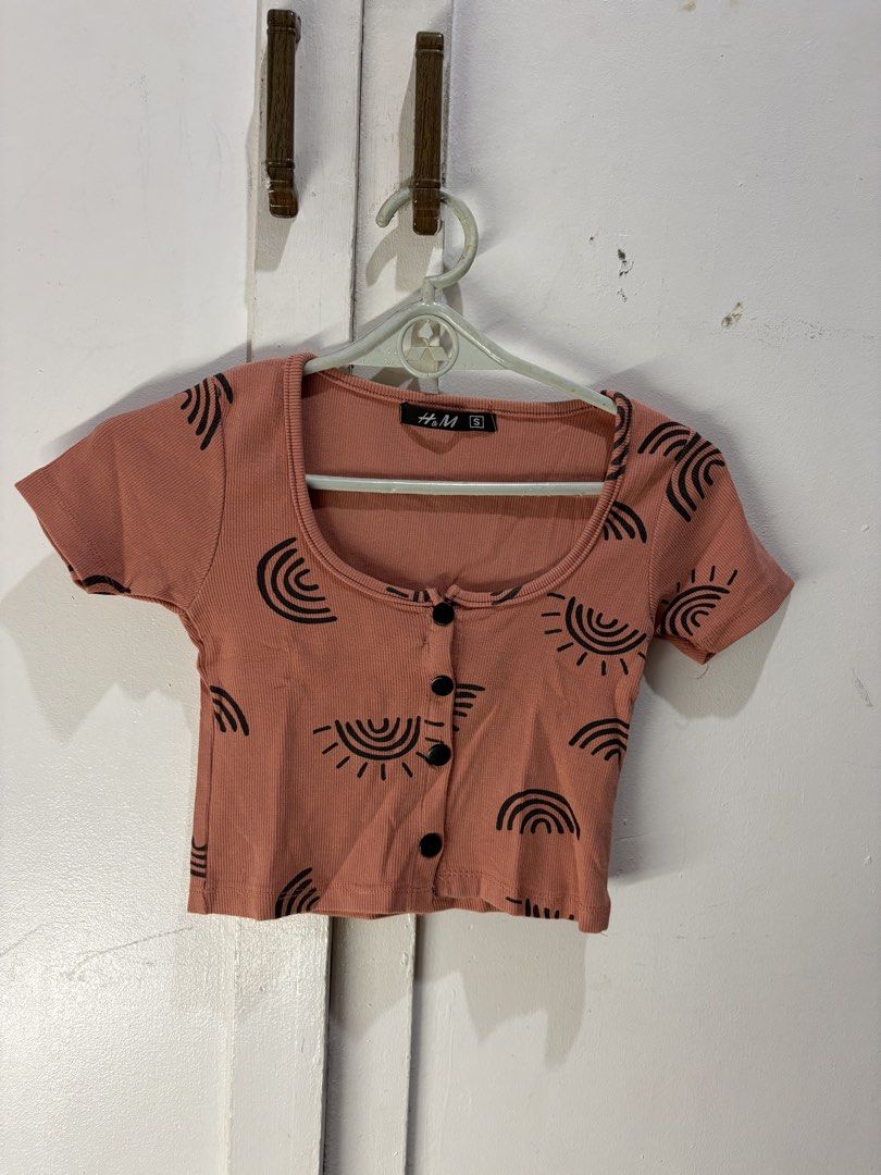 H&M Ribbed Crop Top with Sun & Rainbow Print (Category: Others Tops) located in Malabon City. Submitted by julia4a_ (Listing ID 1459600480, Image 1). Description: - Cute H&M ribbed crop top - All-over sun and rainbow print - Square neckline with button details - Short sleeves - Estimated size S - Great for casual wear or layering.