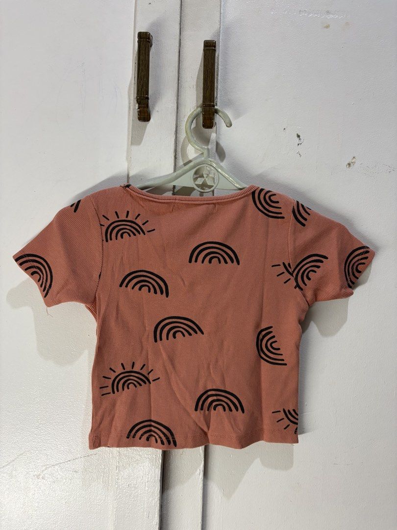 H&M Ribbed Crop Top with Sun & Rainbow Print (Category: Others Tops) located in Malabon City. Submitted by julia4a_ (Listing ID 1459600480, Image 2). Description: - Cute H&M ribbed crop top - All-over sun and rainbow print - Square neckline with button details - Short sleeves - Estimated size S - Great for casual wear or layering.