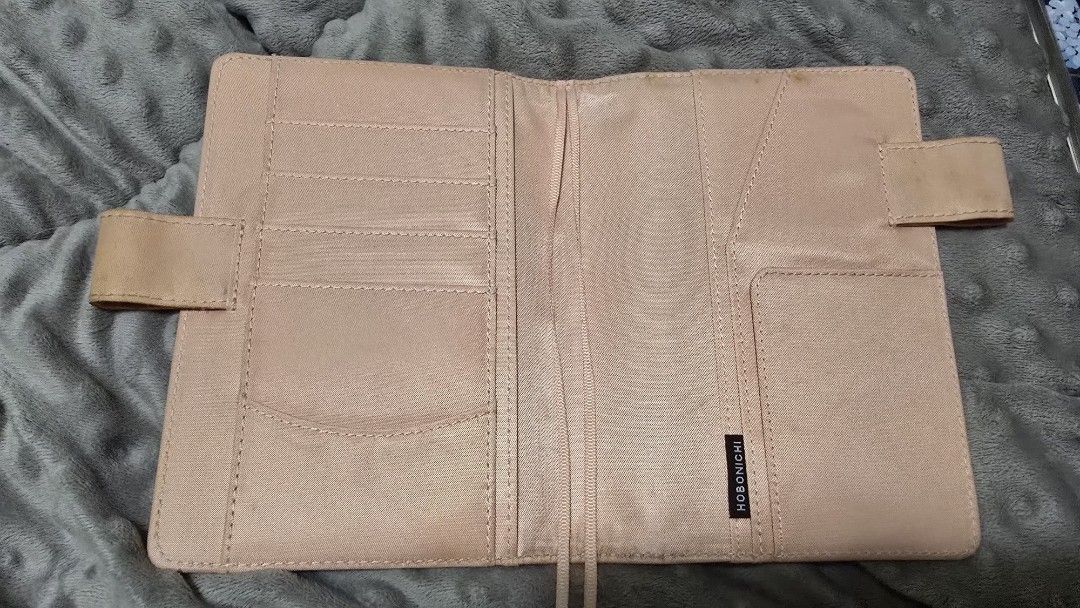 Hobonichi Planner Cover Beige (Category: Stationery & School Supplies) located in Las Pinas. Submitted by insouciant_worrier (Listing ID 1459656875, Image 1). Description: - Hobonichi planner cover - Fits A6 size planners - Multiple card slots and pockets inside - Minor exterior marks and signs of wear (please check photos for details).