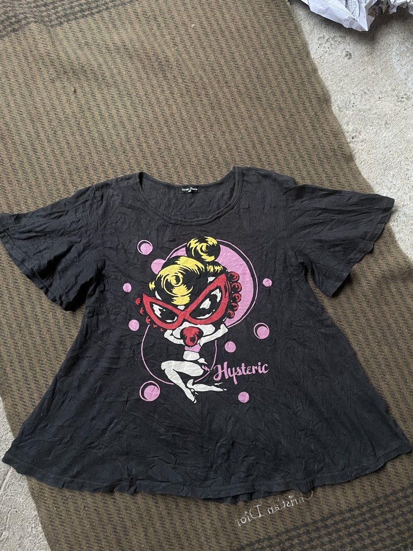Hysteric Glamour Graphic Print (Category: Shirts) located in Siniloan. Submitted by rethr1ft (Listing ID 1459609395, Image 1). Description: - Brand: Hysteric Glamour Mini - Design: Black graphic tee - Front: Features a cute cartoon character - Back: 'Hysteric Sexy Mini' text - Sleeves: Short - Hem: Flared - Style: Casual wear.
