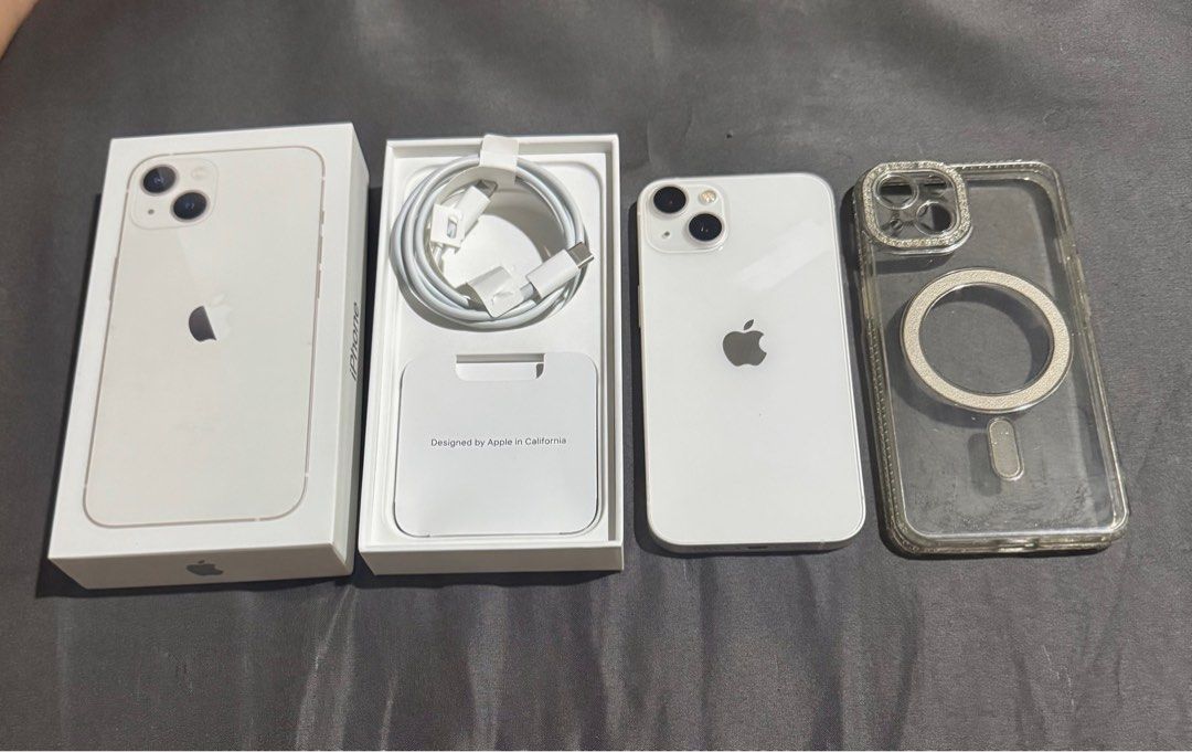 iPhone 13 128gb Starlight (Category: iPhone 13 Series) located in Taguig. Submitted by thereal_doa (Listing ID 1459603209, Image 1). Description: IPhone 13 Starlight (White) 128gb of Storage Local Variant ZP/A Model Factory Unlock No Scratches/Dents 99% Smooth Brandnew Appearance & Performance 86% BatteryHealth Lady owned Case and Tempered since day1 No Issue/All Working No History of Repair Unli Check/Reset upon meetup Inclusions: Case Original 