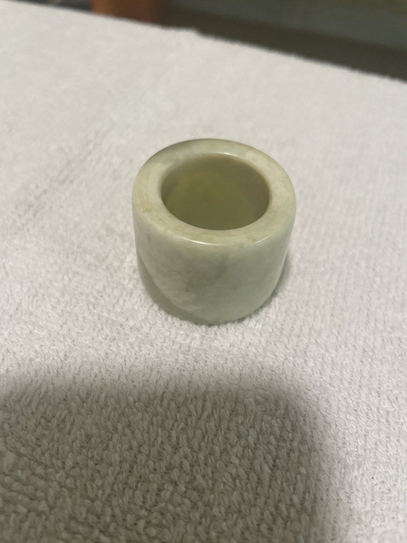 Jade Ring (Category: Accessory holder, box & organizers) located in Singapore. Submitted by kingsmen65 (Listing ID 1459529004, Image 1). Description: - Classic jade ring - Light green color - Features natural inclusions - Smooth finish.