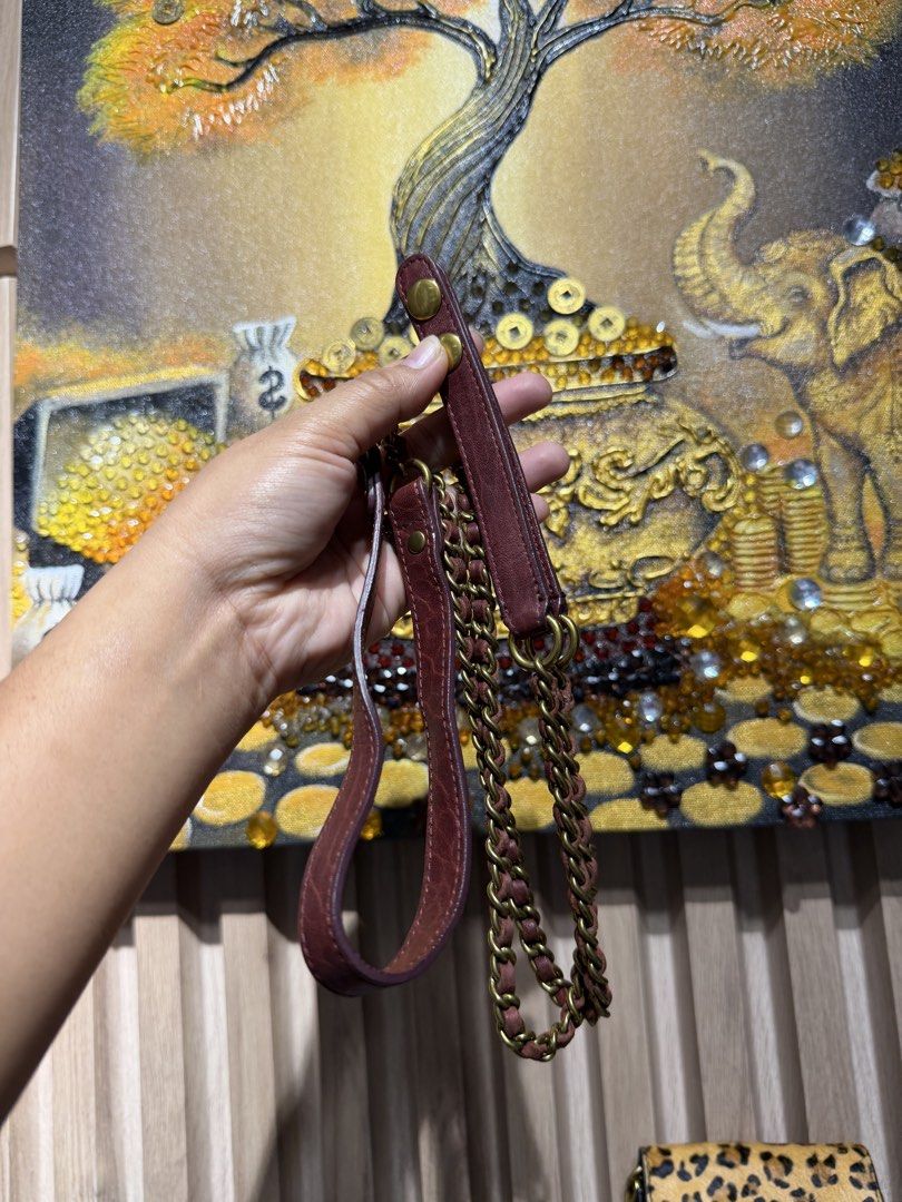 Jerome Dreyfuss Paris Brown Leather Wallet with Chain Strap (Category: Luxury Bags & Wallets) located in Taguig. Submitted by xylasprelovedbag (Listing ID 1459521274, Image 3). Description: - Genuine brown leather wallet - Multiple interior compartments for organization - Detachable chain and leather strap included - Elegant gold hardware details - Ideal for keeping your essentials tidy and accessible.