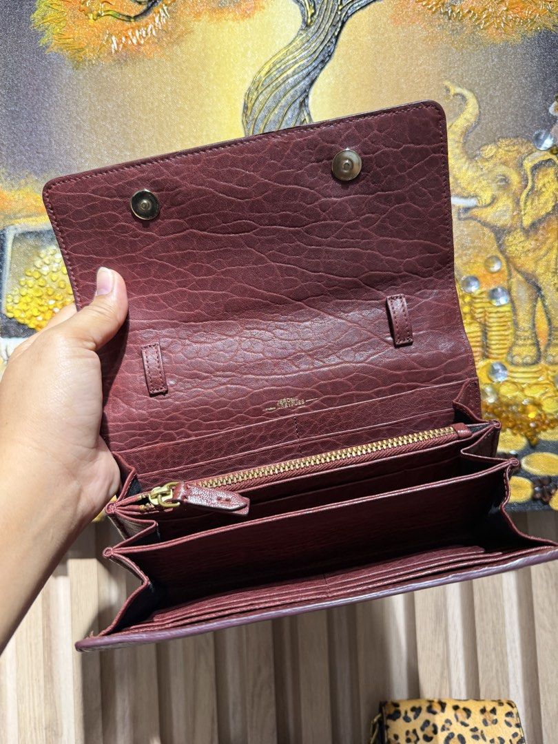 Jerome Dreyfuss Paris Brown Leather Wallet with Chain Strap (Category: Luxury Bags & Wallets) located in Taguig. Submitted by xylasprelovedbag (Listing ID 1459521274, Image 2). Description: - Genuine brown leather wallet - Multiple interior compartments for organization - Detachable chain and leather strap included - Elegant gold hardware details - Ideal for keeping your essentials tidy and accessible.