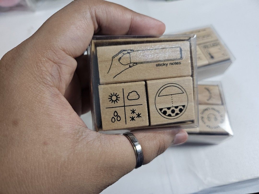 Journaling Stamps Set with Black Ink Pad (Category: Craft Supplies & Tools) located in Pasig City. Submitted by purplewingsph1 (Listing ID 1459607033, Image 2). Description: - Cute wooden stamps perfect for your planner or journal. - Themed sets include weather, daily tasks, and time. - Includes a black 'Craft Ink Pad' suitable for fabric, wood, and paper. - Ideal for organizing your schedule and adding a personal touch. - Unleash your creativity
