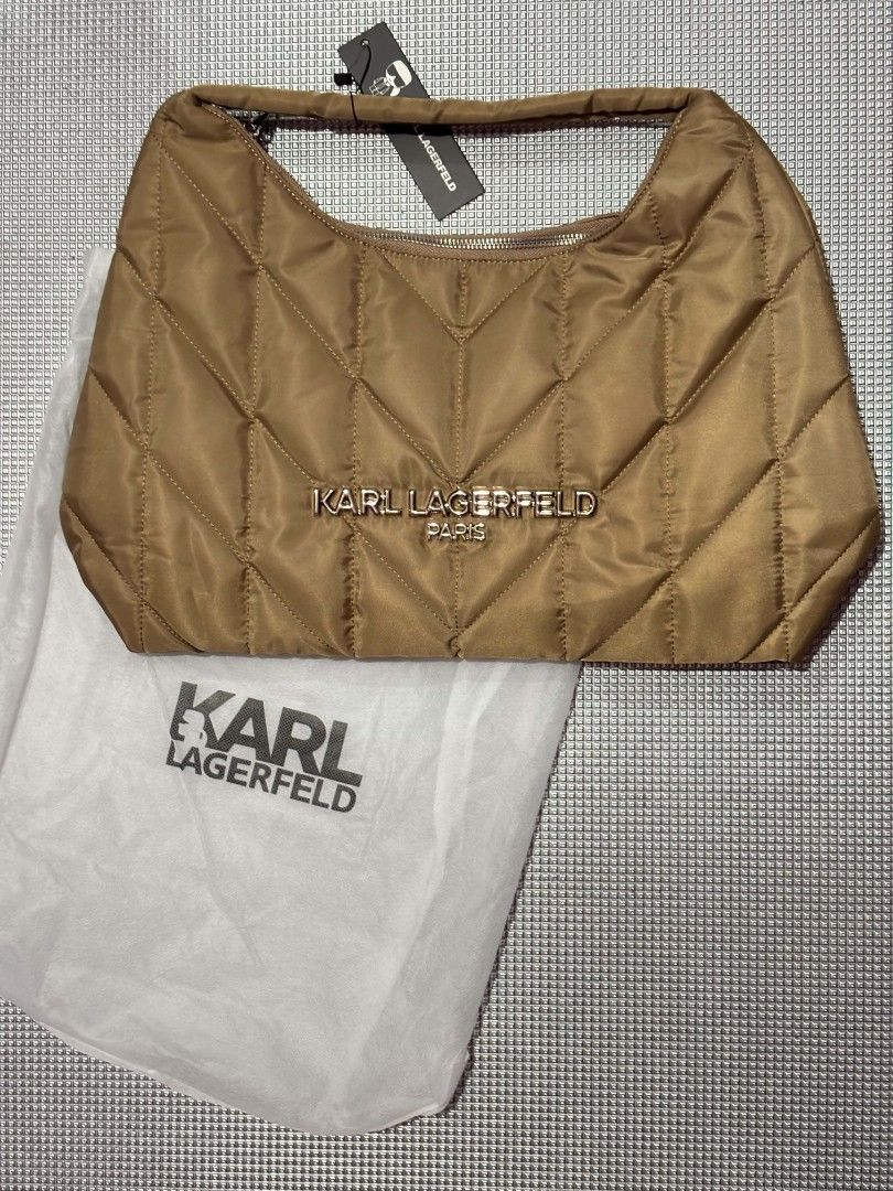 Karl Lagerfeld Quilted Nylon Shoulder Bag (Category: Luxury Bags & Wallets) located in Cavite. Submitted by sweetalittlemonstertoo (Listing ID 1459618749, Image 1). Description: sale no last price before 1800 mop gcash plus sf - Brand: Karl Lagerfeld - Material: Quilted Nylon - Color: Tan - Closure: Zipper top - Exterior Features: Back zipper pocket - Interior Features: Zipper pocket, Slip pocket - Includes: Dust bag - Ideal for: Everyday use.
