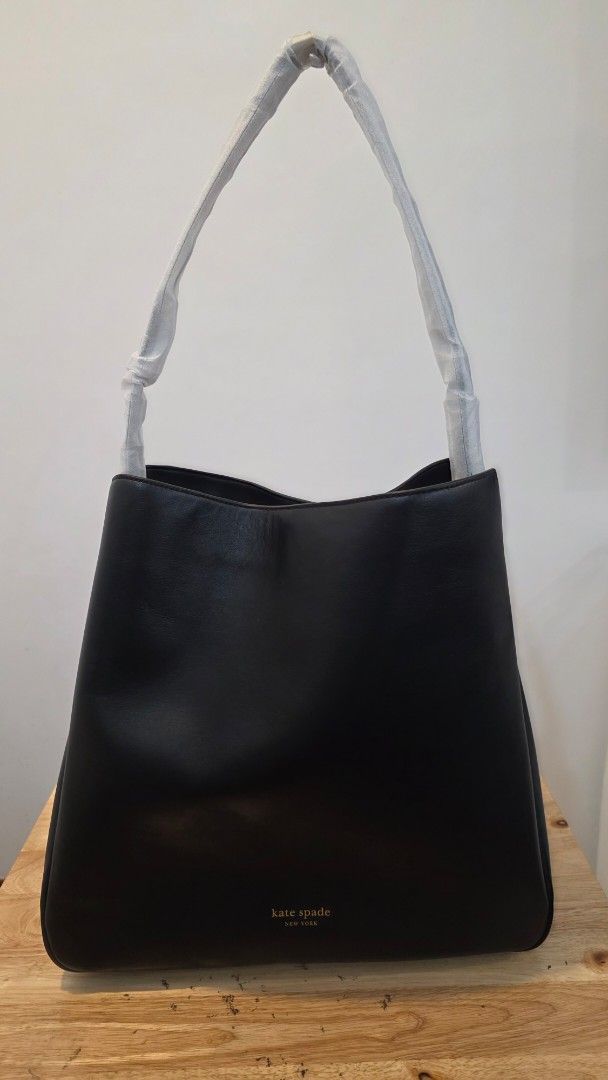 Kate Spade Black Leather Shoulder Bag (Category: Luxury Bags & Wallets) located in Quezon City. Submitted by silentfalcon_df4be6 (Listing ID 1459536224, Image 1). Description: - Brand: Kate Spade New York - Color: Black - Material: Leather - Style: Classic shoulder hobo bag, perfect for everyday use - Condition: Brand new with original tags attached - Features: Strap is wrapped in protective material.
