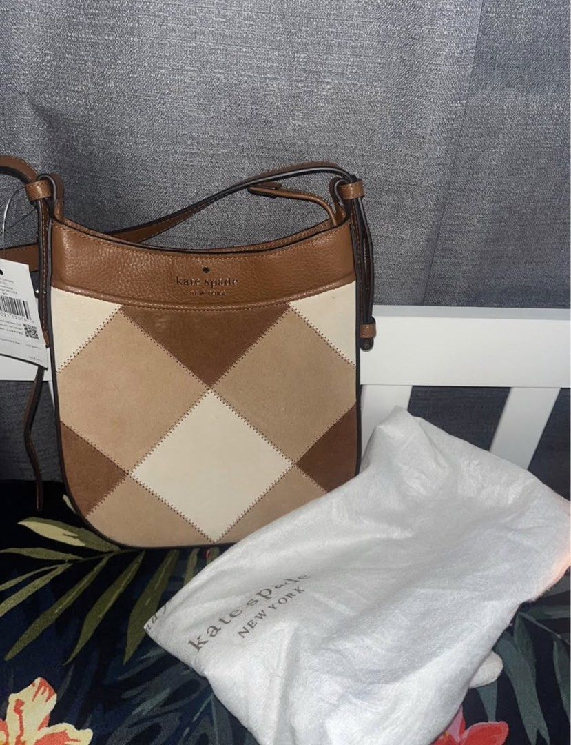 Kate Spade Patchwork Suede Leather Crossbody Bag (Category: Cross-body Bags) located in Andop. Submitted by nikiprelove55563 (Listing ID 1459516268, Image 1). Description: - Authentic Kate Spade crossbody bag - Stylish patchwork design with suede and leather - Neutral color palette: brown and cream - Comes with original dust bag - Adjustable strap for customized comfort - Ideal for everyday use.