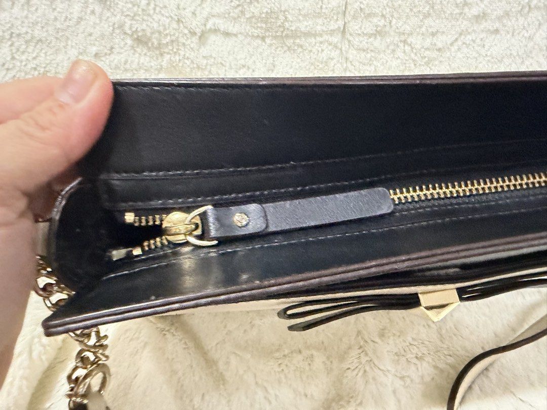 Kate Spade Sling (Category: Luxury Bags & Wallets) located in Caloocan City. Submitted by princessthriftbags (Listing ID 1459582853, Image 3). Description: Preloved pls manage expectation All pics posted The chain sling are still very shiny .