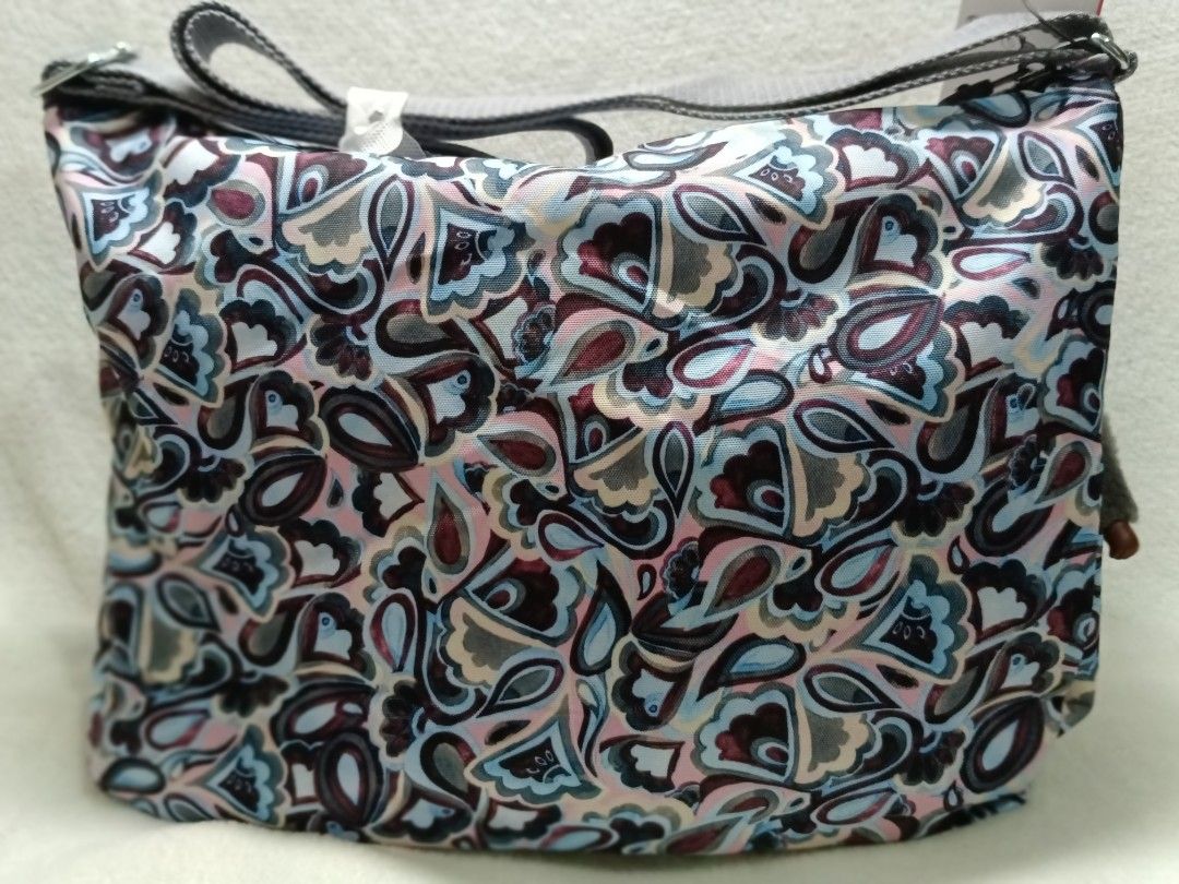 Kipling Sling Bag with Monkey Charm - Colorful Pattern (Category: Cross-body Bags) located in Quezon City. Submitted by shinereign (Listing ID 1459603409, Image 3). Description: - Cute Kipling sling bag - Fun, colorful paisley-like pattern - Multiple zippered pockets on the front - Includes signature Kipling monkey charm - Adjustable strap for comfortable wear - Ideal for everyday use.