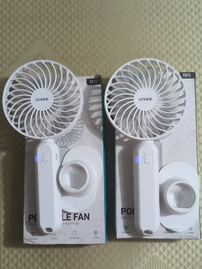 Kivee FA15 Portable Handheld Fan (2 pcs) (Category: Fans) located in Quezon City. Submitted by jhiim (Listing ID 1459596703, Image 2). Description: 300 dalawa na po yan, working parehas. - Set of 2 Kivee FA15 portable fans - Color: White - USB rechargeable - Easy one-click operation - Compact and portable design - Ideal for personal cooling anywhere.