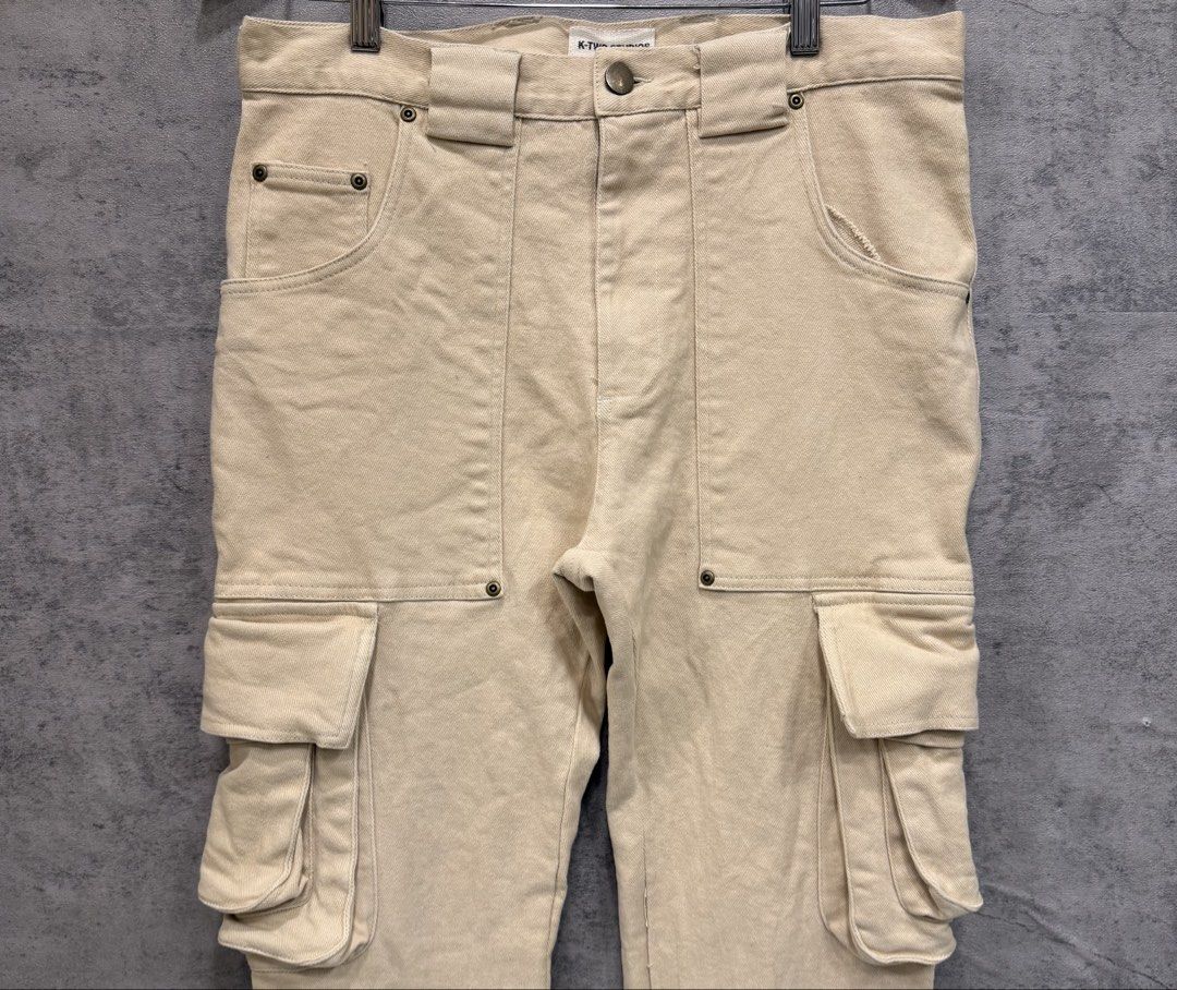 K-TWO STUDIOS - CARPENTER FLARED CARGO PANTS (Category: Trousers) located in Makati City. Submitted by daboy_ (Listing ID 1459670899, Image 2). Description: K-TWO STUDIOS - CARPENTER FLARED CARGO PANTS Size: 32-33 waist Condition: 10/10 Material: 100% Cotton Zipper: YKK Dimensions Length: 42” Inseam: 32” Thigh: 11” Knee: 8” Leg opening: 9” Front rise: 12”.