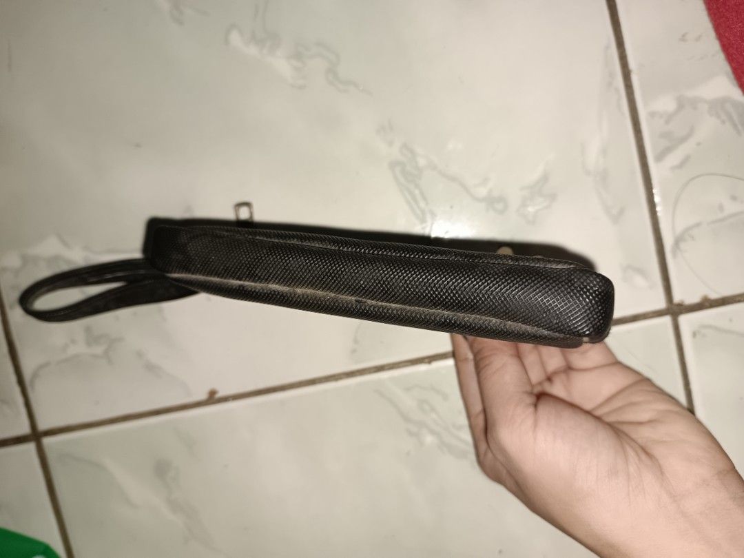 Lacoste Black Coin Pouch with Wrist Strap (Category: Purses & Pouches) located in Manila. Submitted by caaths_collection (Listing ID 1459612413, Image 3). Description: - Black Lacoste Pouch - Zipper closure for secure storage - Convenient small wrist strap - Iconic embossed crocodile logo on the front - Ideal for organizing coins, cards, or small essentials - Compact and easy to carry - preloved.