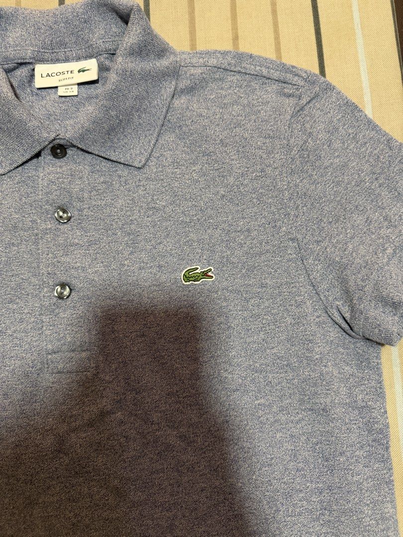 Lacoste Slim Fit Polo Shirt (Category: Tshirts & Polo Shirts ) located in Valenzuela. Submitted by rachmcadams (Listing ID 1459581394, Image 2). Description: P2,100 slightly negotiable! • 100% original (PH store bought) • Size: FR 2 / US XS Slim Fit • Fits up to small body frame • No issue. Mint condition. P.S. It's a bluish/purplish gray. Special color—pricier than the classic ones. Decluttering my boyfriend's closet. Money back guarantee..