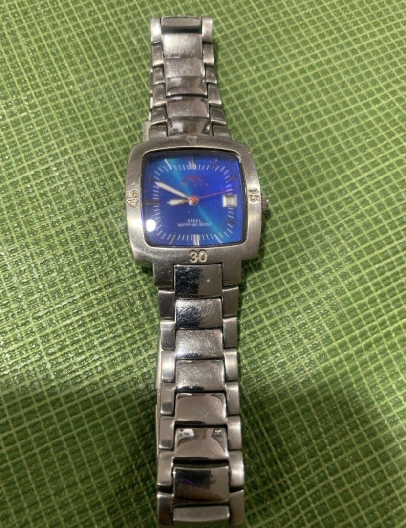 Anne Klein Ladies Water Resist Watch with Blue Dial (Category: Men's Watches) located in Bulacan. Submitted by rafaesarisari (Listing ID 1459614164, Image 1). Description: - Silver-tone metal watch - Vibrant blue dial - Durable steel band with classic link design - Water resistance up to 100 meters (10 ATM) - Square-ish watch face - Clear hour markers - Convenient date window - Ideal for everyday wear and water activities.