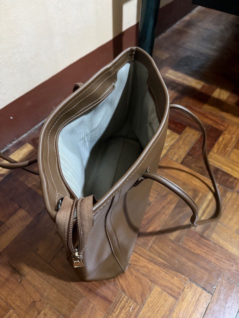 Leather Tote Bag (Category: Luxury Bags & Wallets) located in Manila. Submitted by only_alyssacloset (Listing ID 1459552942, Image 3). Description: Selling my leather shoulder/tote bags 👜 Both are in good condition and have only been used a few times. Perfect as an office/work bag or for everyday use. Spacious, stylish, and easy to match with different outfits. 🖤 Black 🤎 Brown.