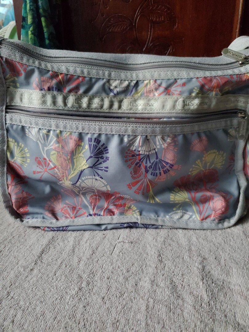LESPORTSAC BAG FLORAL GRAY PRINT (Category: Shoulder Bags) located in Manila. Submitted by smicolen (Listing ID 1459624792, Image 2). Description: - Grey LeSportsac shoulder bag - Eye-catching colorful floral print - Multiple zippered compartments for organization - Adjustable strap for comfortable wear - Dimensions: Approx. L-9 1/2", W-12 3/4", Bottom-6" - Ideal for everyday use issues: sling binawasan Ginawang shoulder bag instead of crossbody 