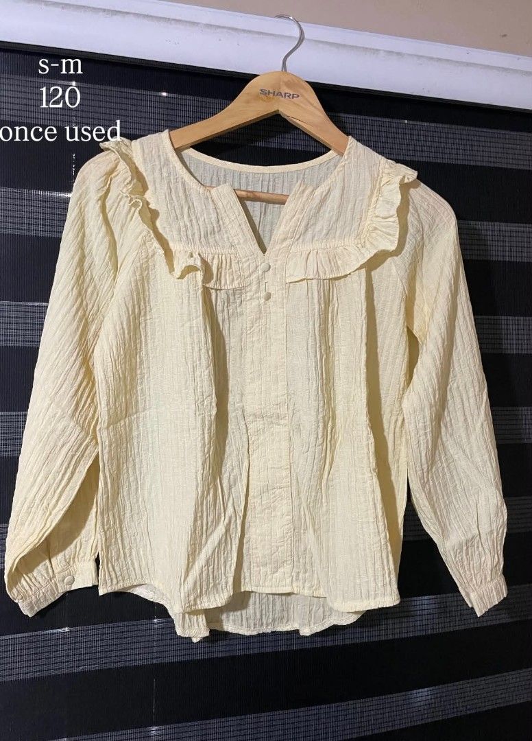 Light Yellow Textured Blouse with Ruffle Collar (Category: Blouses) located in Cavite. Submitted by yoonhanzino04 (Listing ID 1459623284, Image 1). Description: - Cute light yellow blouse - Textured fabric for a nice feel - Pretty ruffle collar - Button details down the front - Long sleeves with button cuffs - Size S-M - Only worn once - Great for casual wear - direct j&t - x/twitter acc: @lesyeuxderiss (preloved by ris).