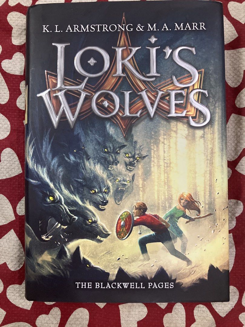 Loki's Wolves by K.L. Armstrong & M.A. Marr (Category: Storybooks) located in Manila. Submitted by bronzemedal (Listing ID 1459566968, Image 1). Description: - Title: Loki's Wolves - Authors: K.L. Armstrong and M.A. Marr - Series: The Blackwell Pages - Genre: Fantasy Adventure - Themes: Norse Mythology, Fierce Wolves, Brave Characters - Target Audience: Young Adult Readers - Highlights: Action-packed, Mythological elements.