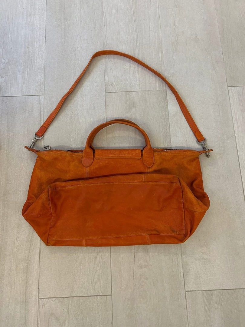 Longchamp Orange Suede Tote Bag with Shoulder Strap (Category: Luxury Bags & Wallets) located in Manila. Submitted by coolbanana852 (Listing ID 1459659596, Image 2). Description: - Brand: Longchamp - Material: Suede - Color: Bright Orange - Features: Top handles, detachable shoulder strap - Interior: Signature horse pattern lining, spacious with a zippered pocket - Use: Ideal for everyday use or travel - Style: Versatile and eye-catching Was boug