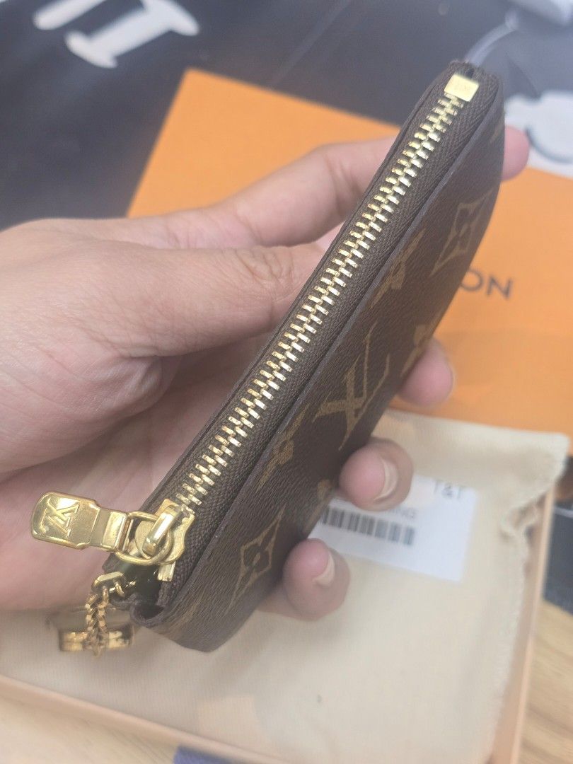 Louis Vuitton Monogram Canvas Key Pouch (Category: Luxury Bags & Wallets) located in Taguig. Submitted by mluxeph (Listing ID 1459534990, Image 3). Description: Louis Vuitton Monogram Canvas Key Pouch Gender: Unisex Material: Coated canvas Stamp: CT1245 Year: 2025 Interior: One main compartment Measurements: 4.75”L X 0.25”W X 2.75”H Handle Drop: None Hardware: Gold tone Inclusions: Original box and original dust bag.