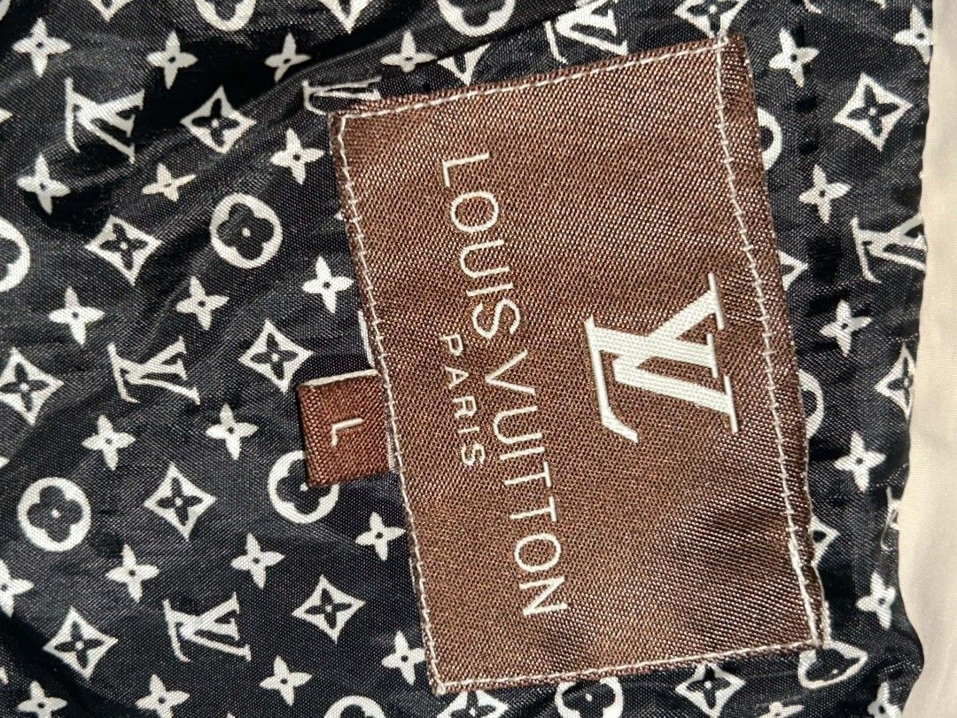Louis Vuitton Monogram Hooded Jacket (Category: Coats, Jackets and Outerwear) located in Manila. Submitted by kkiato (Listing ID 1459595443, Image 2). Description: - Lightweight Louis Vuitton jacket - Detachable hood - Iconic LV monogram print on inner lining and hood - Zip closure with branded zipper pull - Small tear on the left side near the hem - Great for layering .