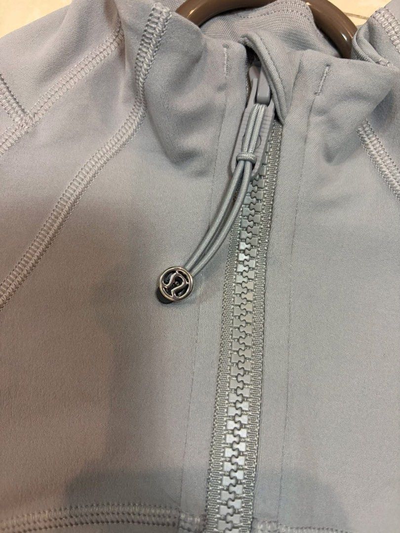 Lululemon Define Jacket Nulu - Size 2 (Category: Activewear) located in Manila. Submitted by danegaddi140004 (Listing ID 1459634196, Image 2). Description: Personal use. Need to upsize. Still good as new. - Grey Lululemon jacket - Full zip closure - Thumbholes on sleeves - Two zippered front pockets .