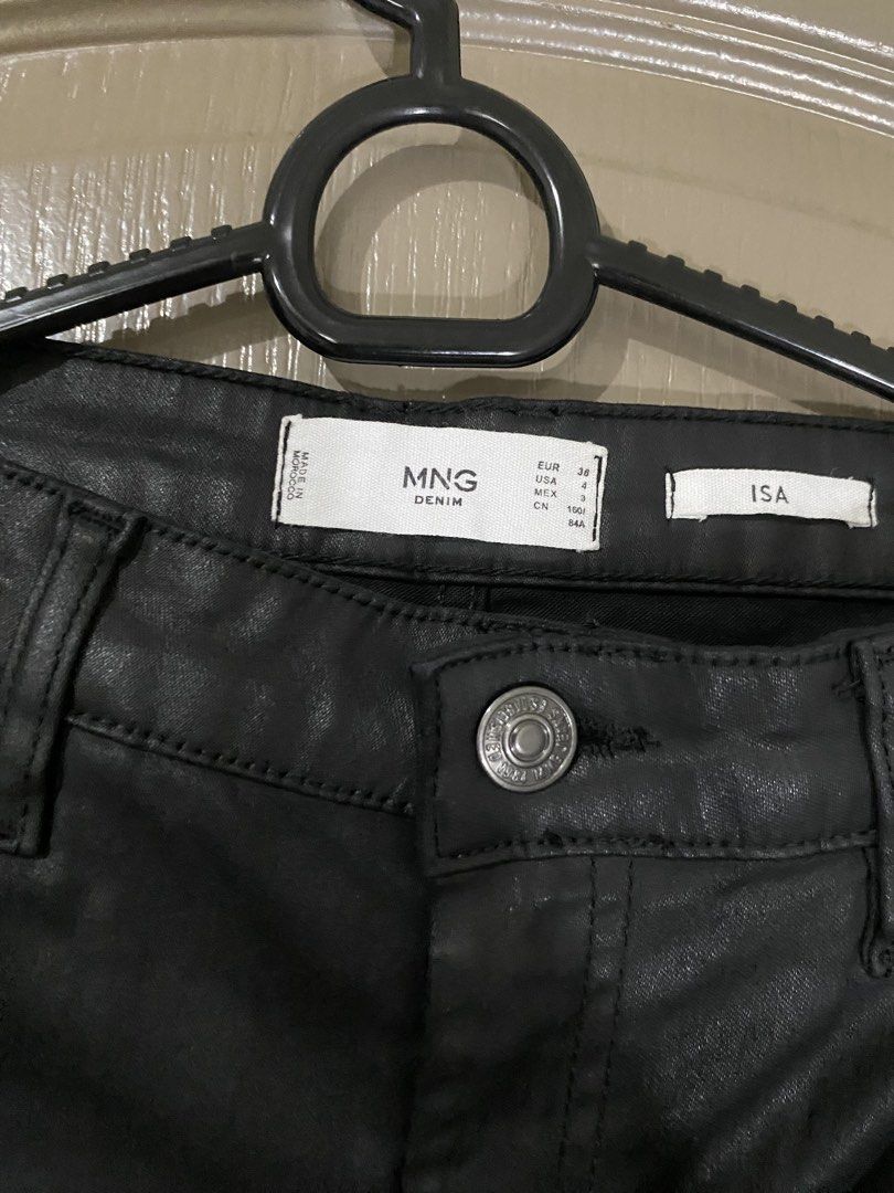 Mango Black Coated Skinny Jeans (Category: Jeans) located in Pasig City. Submitted by fountainpenmd (Listing ID 1459582675, Image 2). Description: - Mango black coated skinny jeans - Size: EUR 36 / USA 4 - Features a slight sheen - Comfortable and versatile for dressing up or down - used only once for Christmas party outfit. 🥲.