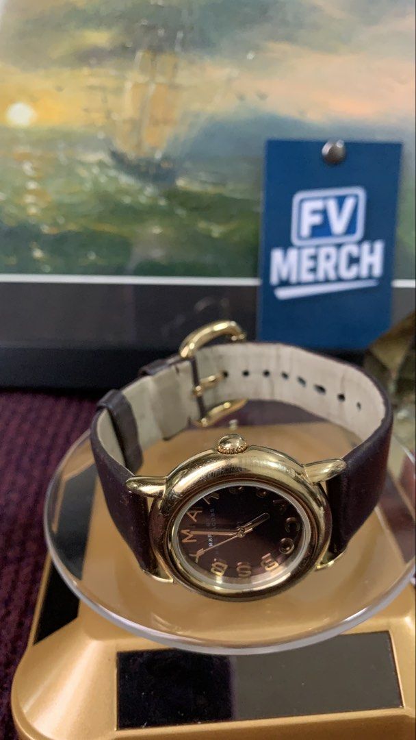 Marc Jacobs Gold-tone Watch (Category: Women's Watches) located in Mandaluyong City. Submitted by fv_merch (Listing ID 1459629386, Image 3). Description: Marc Jacobs Gold-tone stainless with chocolate brown/dark burgundy dial and a genuine brown leather strap - parts original (dial, strap, etc) *stainless steel *water resistant 5 atm Dial+Bezel Size: 2.8cm ; women's watch Strap size: 20cm Php 2800.