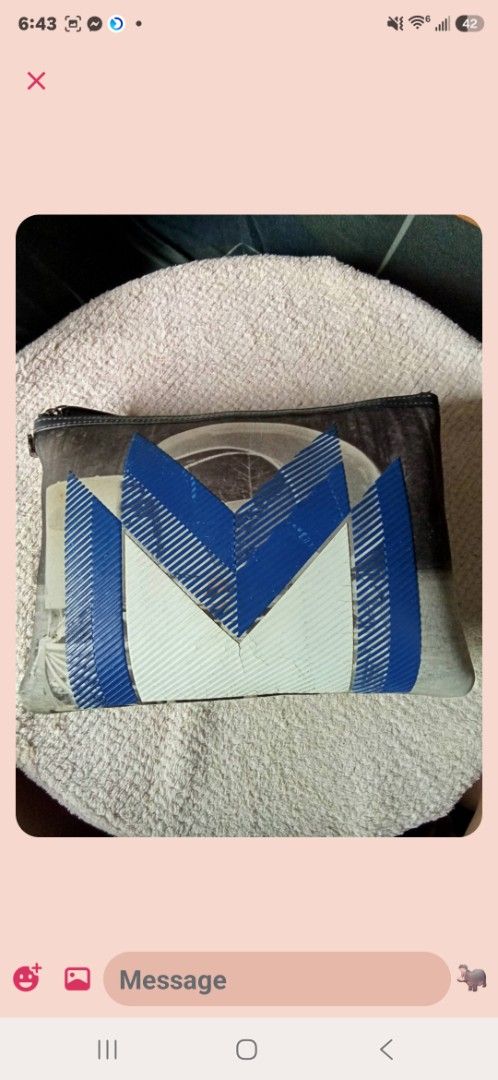 MCM Pouch Clutch Bag Monogram (Category: Luxury Bags & Wallets) located in Aguilar. Submitted by rica040104 (Listing ID 1459660073, Image 1). Description: - Authentic MCM pouch - All-over signature monogram print - Unique blue and white geometric design on front - Zipper closure - Versatile: use as a clutch or bag organizer - Dimensions: approximately 10 inches wide.
