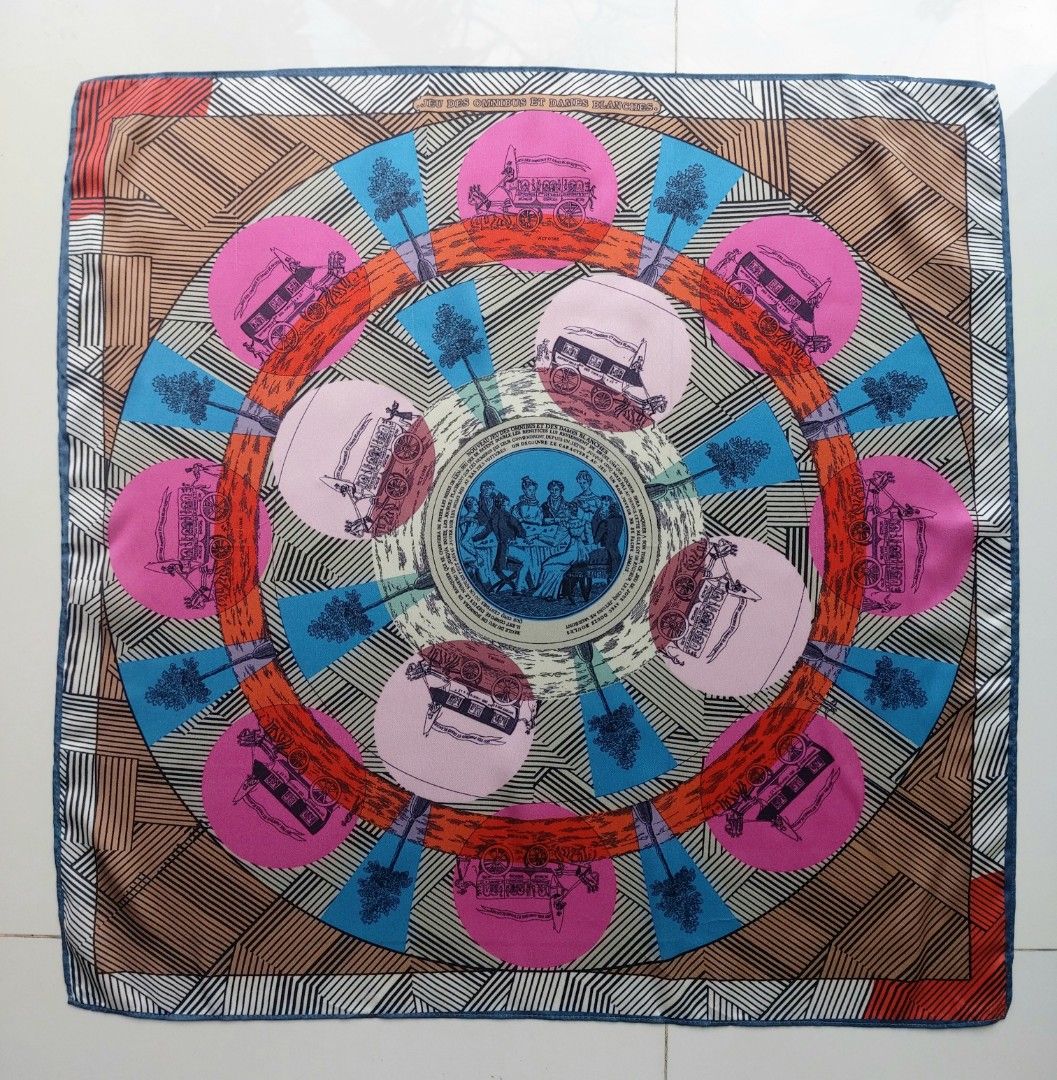 Melissa Silk Scarf (Category: Scarves) located in Lapu Lapu. Submitted by agnesapm_29813 (Listing ID 1459596003, Image 1). Description: - Features the 'Jeu des Omnibus et Dames Blanches' design - Vibrant colors and intricate patterns - Measurements: width-22 inches, height-22 inches - Versatile accessory to elevate any outfit - Ideal for collectors of fine scarves.