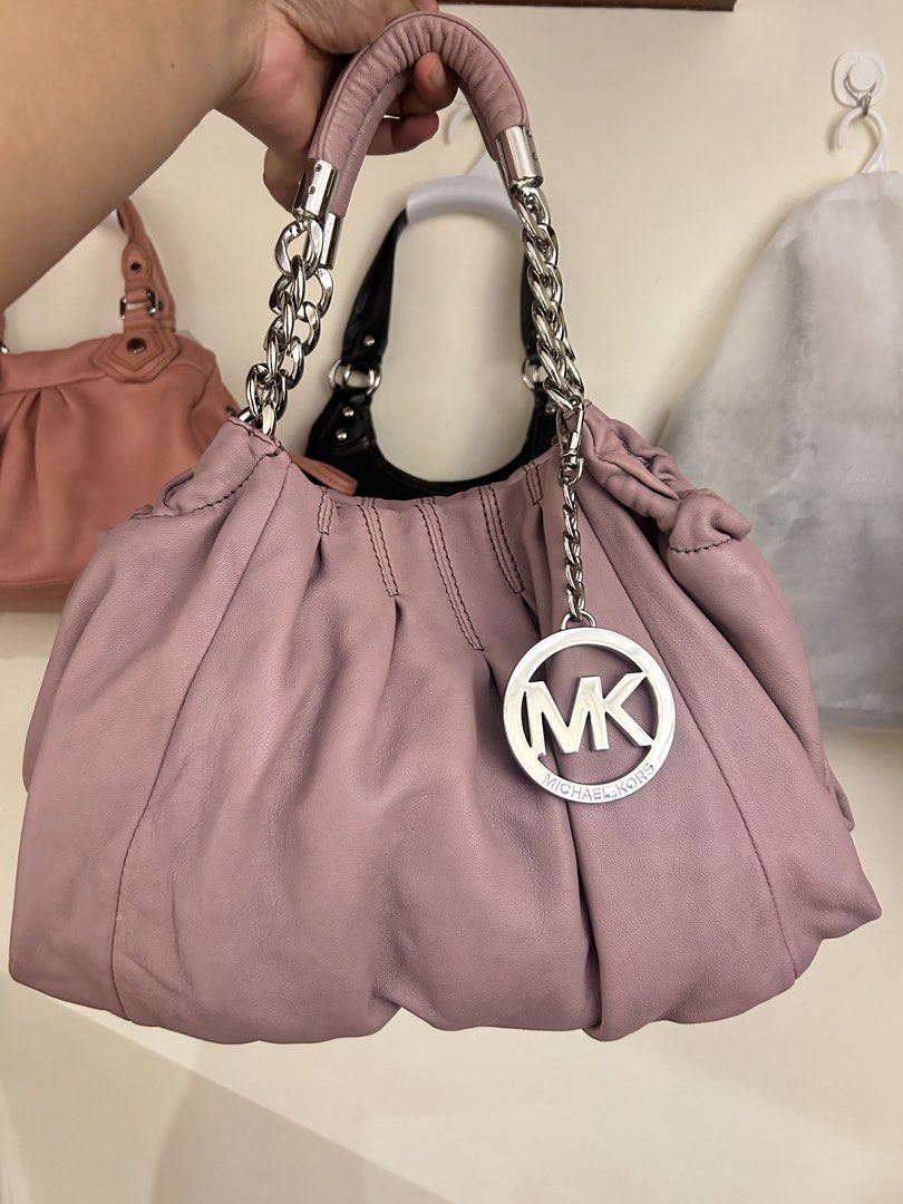 Michael Kors Erin Large Shoulder Bag (Category: Shoulder Bags) located in Caloocan City. Submitted by cindylou_ (Listing ID 1459575295, Image 1). Description: ⭐️Serious buyers only, please. No lowballers. Last price posted! Model: Erin Large Shoulder Bag Aesthetic: Classic slouchy Y2K hobo style. Color: Soft wisteria/lilac pastel purple. Material: Premium pleated and gathered genuine leather. Hardware: Silver-tone chain-link accent handles. Charm