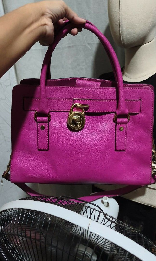 Michael Kors Pink Leather Satchel Bag (Category: Luxury Bags & Wallets) located in San Juan City. Submitted by bellarina05 (Listing ID 1459133908, Image 1). Description: - Authentic Michael Kors satchel bag - Vibrant bright pink saffiano leather - Elegant gold hardware details - Dual top handles for easy carrying - Detachable shoulder strap for versatility - Multiple interior compartments for organization - Ideal for everyday use or as a stylish 