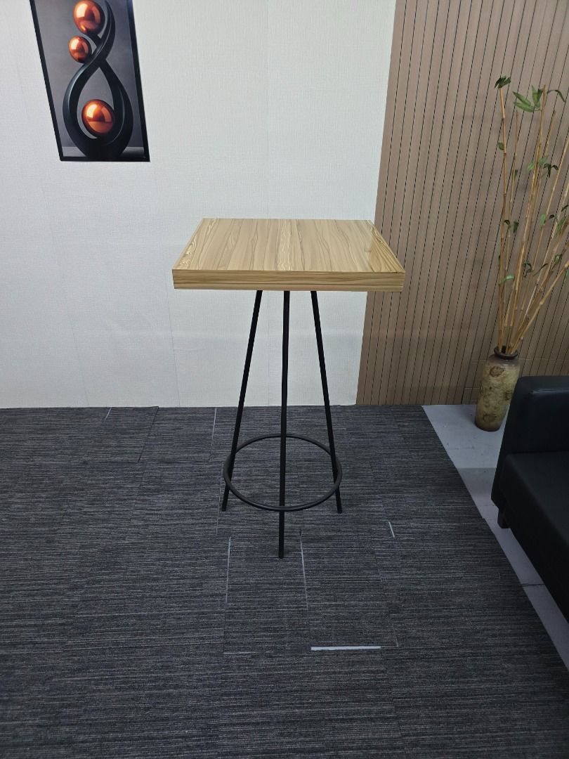 Modern Square Top Bar Table with Black Metal Legs (Category: Tables & Sets) located in Quezon City. Submitted by kevinmacabata12997160 (Listing ID 1459542489, Image 2). Description: - Stylish bar table - Light wood grain square top - Sturdy black metal legs with circular footrest - Ideal for small dining areas or as a standing desk - Minimalist design complements any decor - Easy to clean surface.