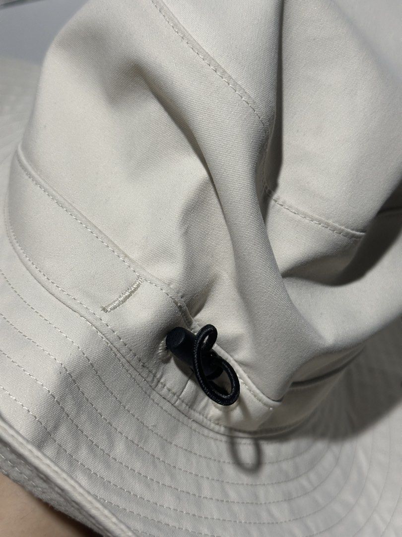 MUJI Bucket Hat Beige Cotton Polyester Nylon (Category: Hats & Beanies) located in Baguio. Submitted by miss_misery (Listing ID 1459651844, Image 3). Description: - Brand: MUJI - Color: Beige - Material: Cotton, Polyester, Nylon - Features: Adjustable drawstring for a secure fit - Benefits: Ideal for sunny days, easy to pack and wear - Condition: Please check photos for details.