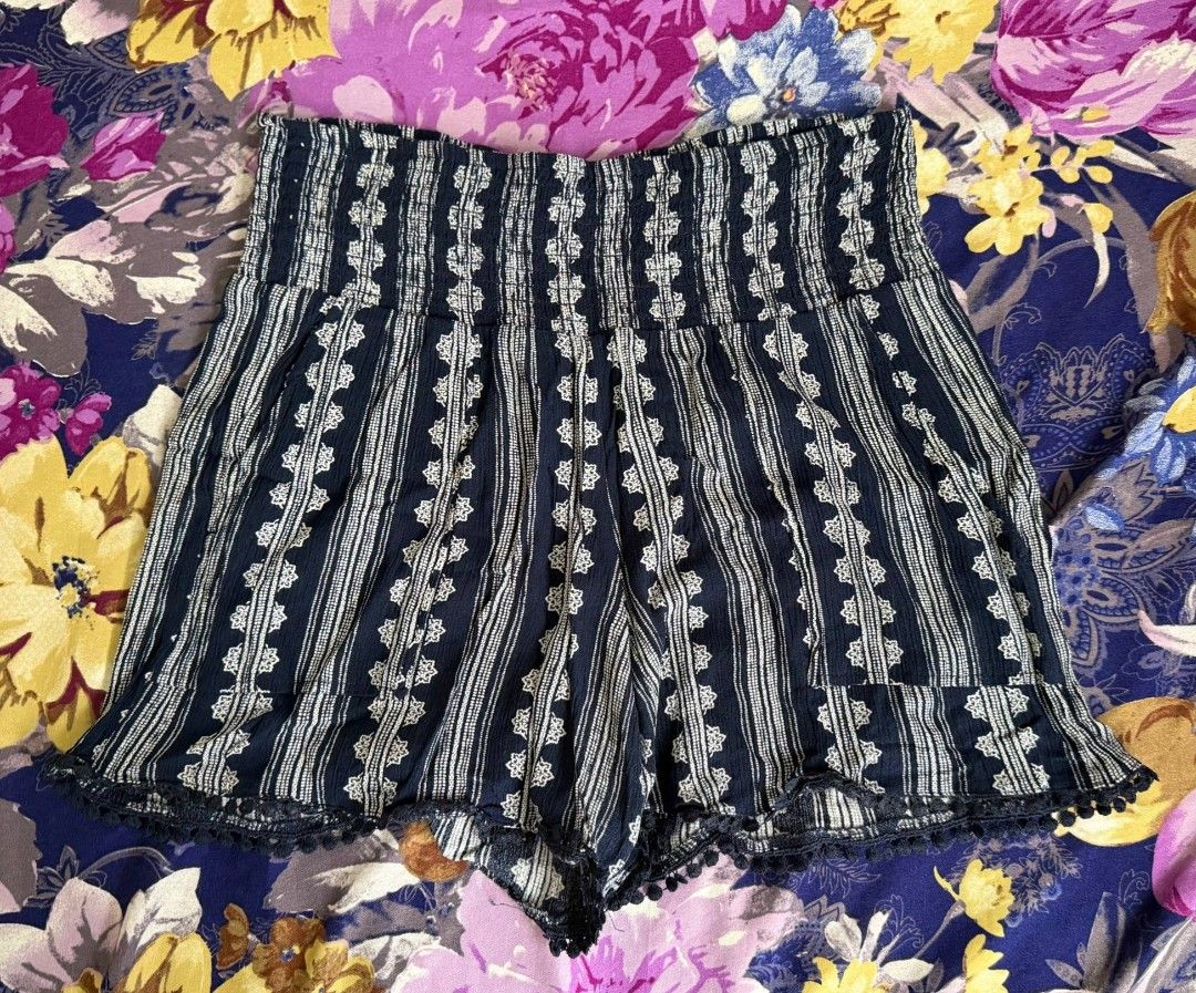 navy and white patterned smocked pull-on waist shorts | beach boho aesthetic (Category: Shorts) located in Manila. Submitted by laurloopsy (Listing ID 1459546336, Image 1). Description: - fits S to M - cute navy and white patterned pull-on beach shorts - has a pom-pom trim along the hem - ideal for casual wear or lounging - Made in Vietnam.