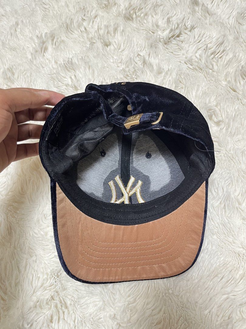 New York Yankees Velvet Cap MLB (Category: Caps & Hats) located in General Santos City (Dadiangas). Submitted by crisjayg (Listing ID 1459607974, Image 3). Description: - Dark blue velvet cap - Gold NY Yankees logo - Adjustable strap at the back - MLB detailing on strap - Tan brim lining inside - Shows some signs of wear on the inner band - Ideal for any New York Yankees fan.