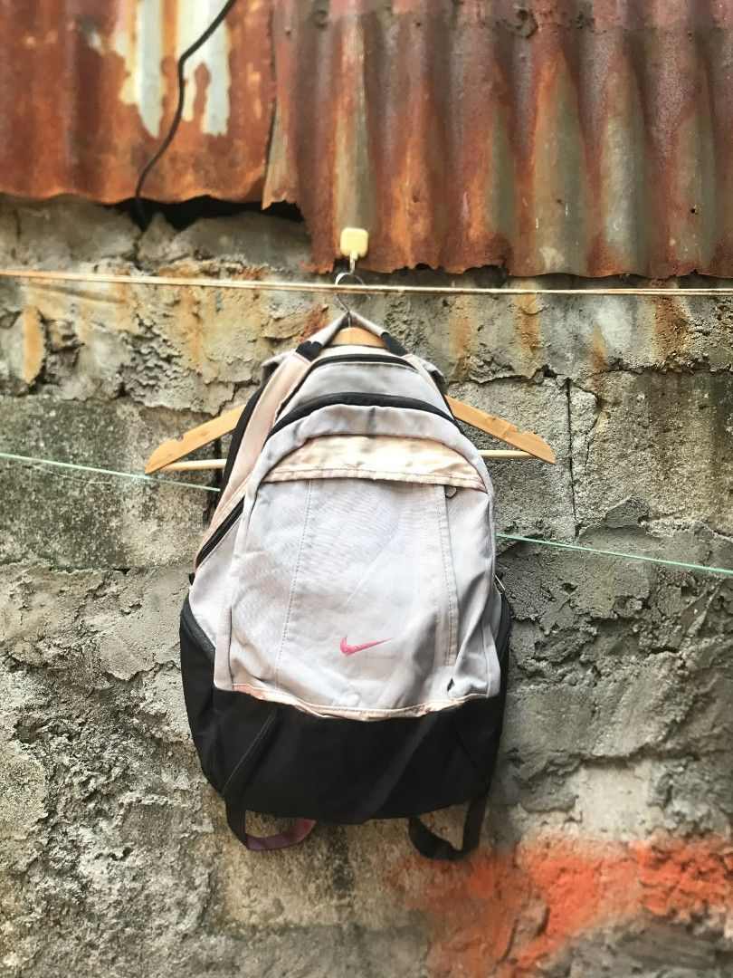 Nike Backpack Grey Black Pink Accents (Category: Backpacks) located in Quezon City. Submitted by carlodepaz (Listing ID 1459600912, Image 1). Description: Nike bagpack embriod logo Replace zipper 7/10 condition 450 freeship via jnt.