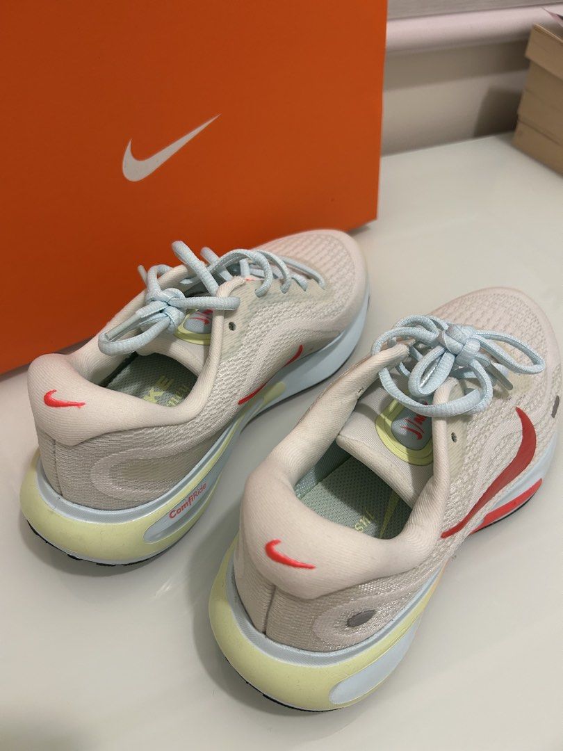 Nike ComfiRide Running Shoes (Category: Sneakers) located in Paranaque City. Submitted by pearlooosh (Listing ID 1459648572, Image 1). Description: - White Nike running shoes - Red and yellow accent colors - Light blue laces - Original Nike box included - Ideal for running and everyday wear - Comfortable and stylish design.