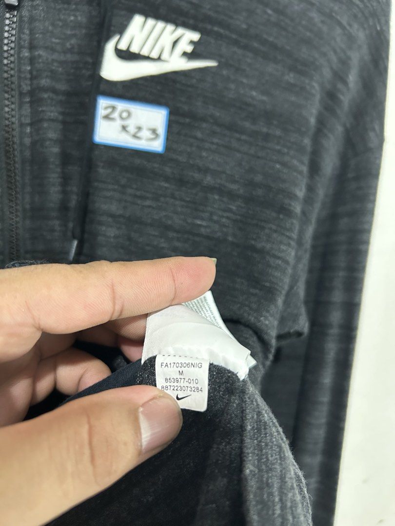 Nike Grey Heathered Full Zip Hoodie Jacket (Category: Coats, Jackets and Outerwear) located in Mandaluyong City. Submitted by 0lg2026 (Listing ID 1459689067, Image 3). Description: - Grey heathered Nike full zip hoodie - Size: Medium (M) - Features classic Nike logo on chest - Repeating Nike branding on inside collar - Versatile for casual wear or light workouts - Easy to layer.