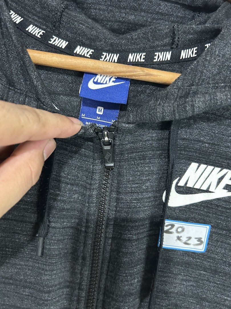 Nike Grey Heathered Full Zip Hoodie Jacket (Category: Coats, Jackets and Outerwear) located in Mandaluyong City. Submitted by 0lg2026 (Listing ID 1459689067, Image 2). Description: - Grey heathered Nike full zip hoodie - Size: Medium (M) - Features classic Nike logo on chest - Repeating Nike branding on inside collar - Versatile for casual wear or light workouts - Easy to layer.